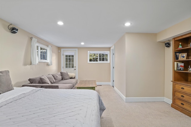 bedroom featuring light carpet