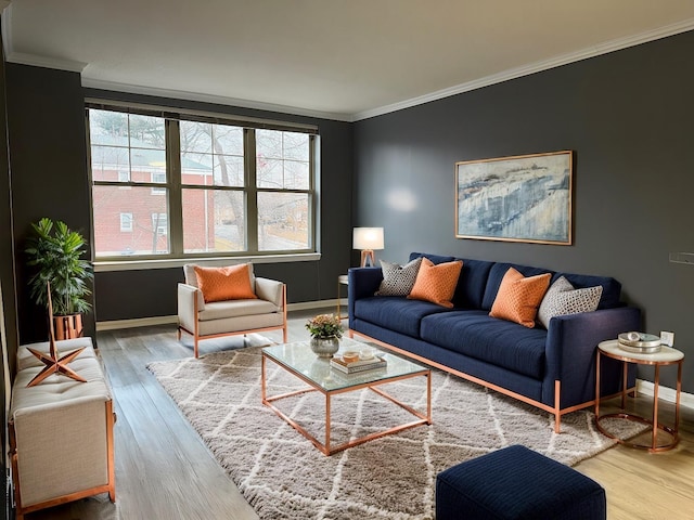 living room with hardwood / wood-style flooring, crown molding, and a wealth of natural light