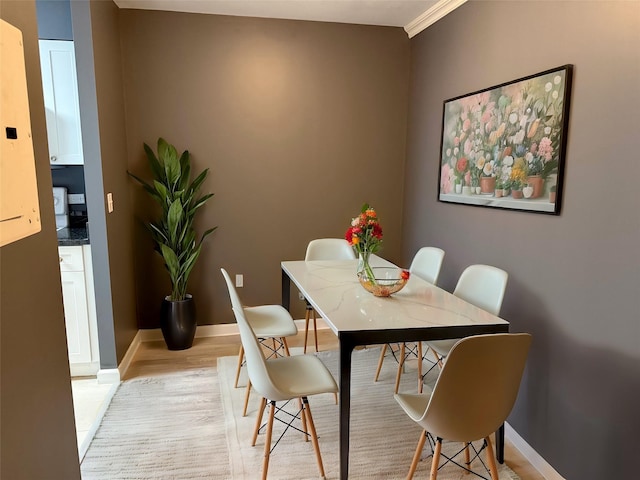 dining space featuring light wood-type flooring