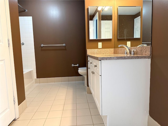 bathroom featuring vanity, toilet, and tile patterned flooring