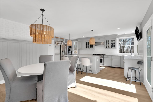 dining room featuring light wood finished floors and recessed lighting