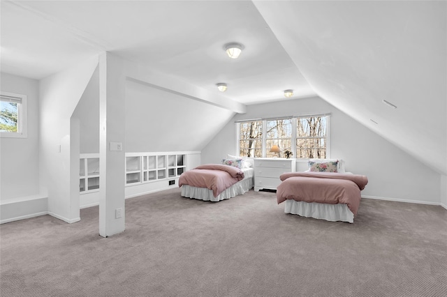 carpeted bedroom with baseboards and vaulted ceiling