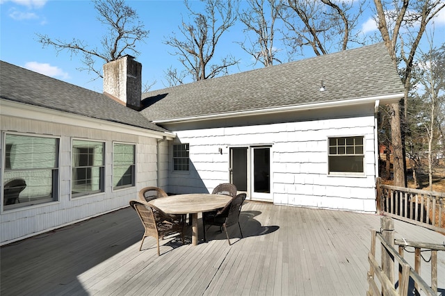 wooden deck with outdoor dining area