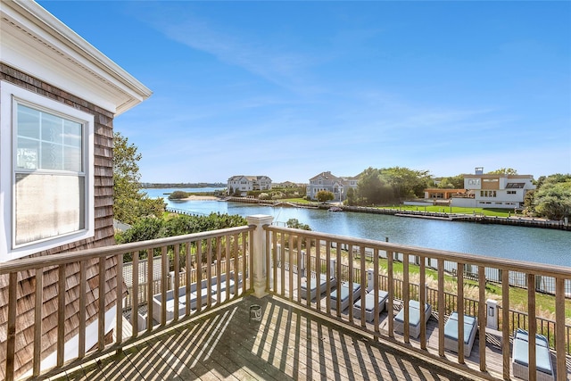 wooden deck featuring a water view