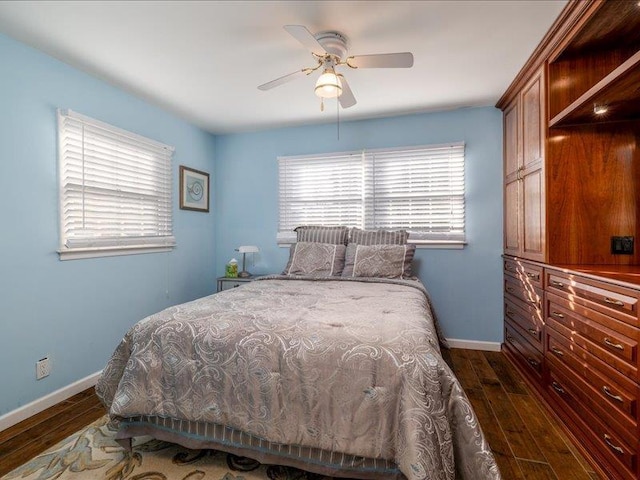 bedroom featuring ceiling fan and dark hardwood / wood-style flooring