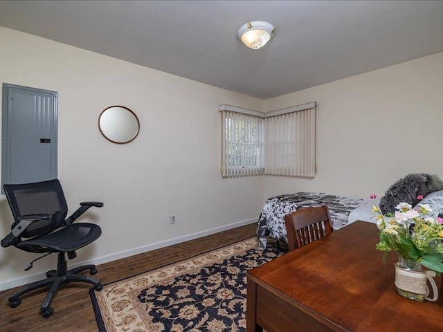 office featuring hardwood / wood-style floors and electric panel