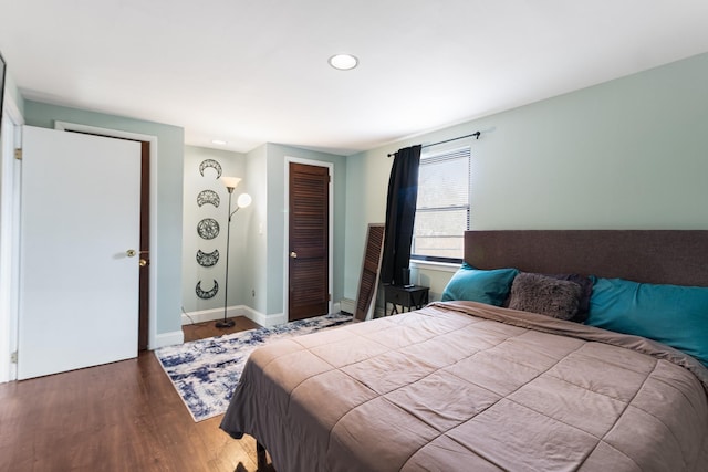 bedroom featuring hardwood / wood-style flooring and a closet