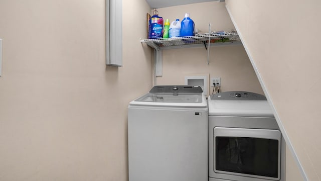 washroom with independent washer and dryer