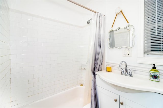 bathroom featuring vanity and shower / tub combo