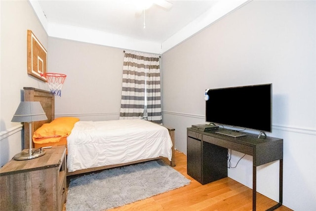 bedroom with ceiling fan and light wood-type flooring