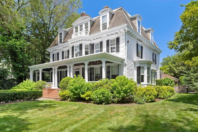 157 Merlin Ave, Sleepy Hollow, NY 10591 - view of front facade with a front lawn, mansard roof, and a porch