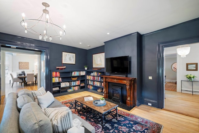 157 Merlin Ave, Sleepy Hollow, NY 10591 - living area featuring wood finished floors, a chandelier, ornamental molding, and recessed lighting