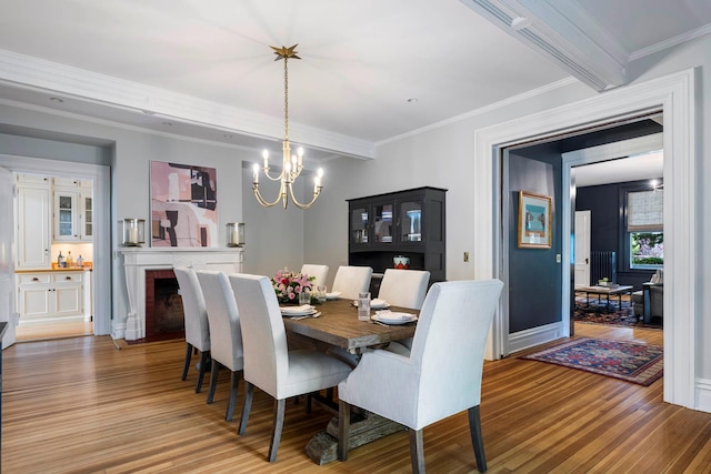 157 Merlin Ave, Sleepy Hollow, NY 10591 - dining room with wood finished floors, crown molding, and a chandelier