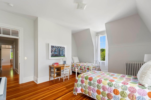 157 Merlin Ave, Sleepy Hollow, NY 10591 - bedroom featuring radiator, wood finished floors, and lofted ceiling