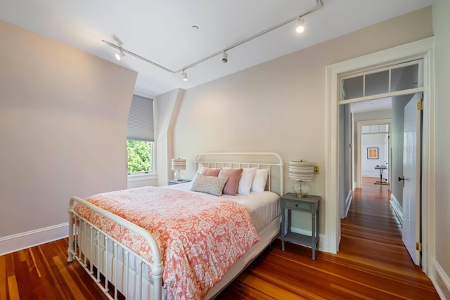 157 Merlin Ave, Sleepy Hollow, NY 10591 - bedroom featuring wood finished floors, track lighting, and attic access