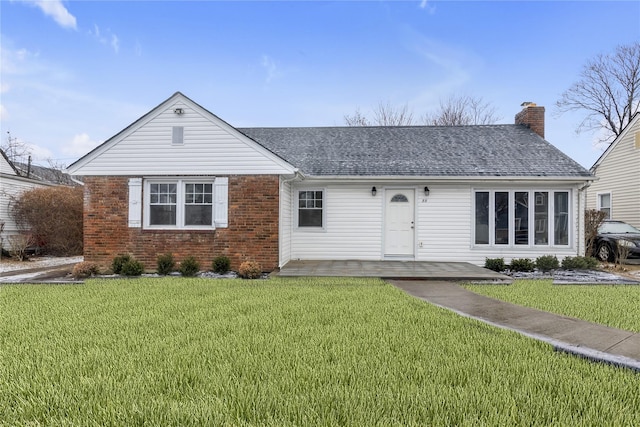 ranch-style house with a front lawn