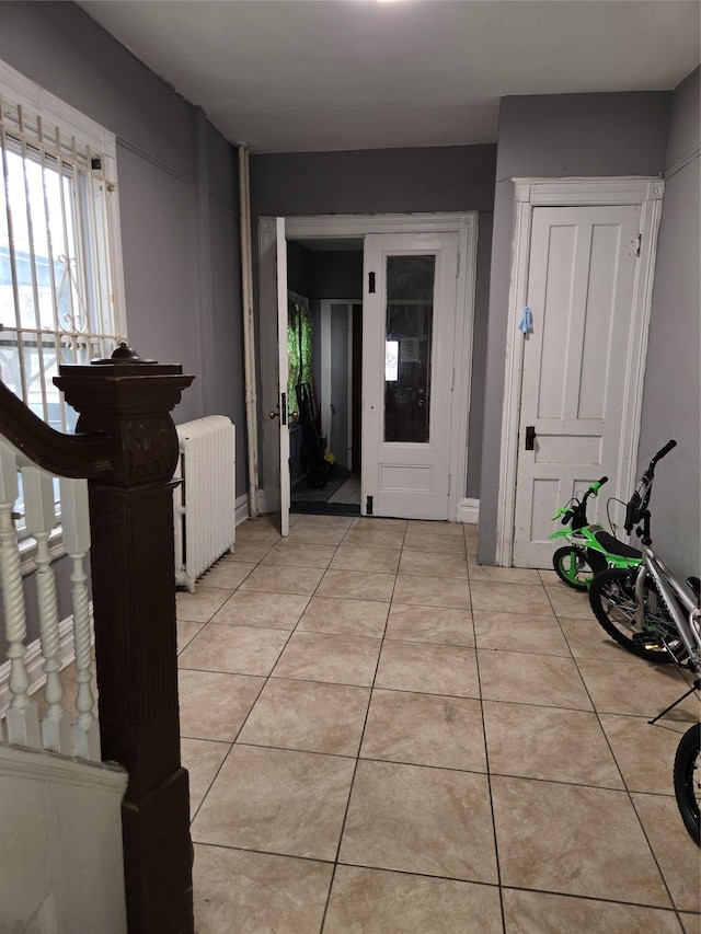 tiled entryway with radiator heating unit