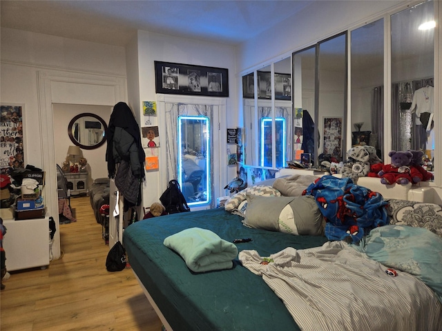 bedroom with light hardwood / wood-style flooring