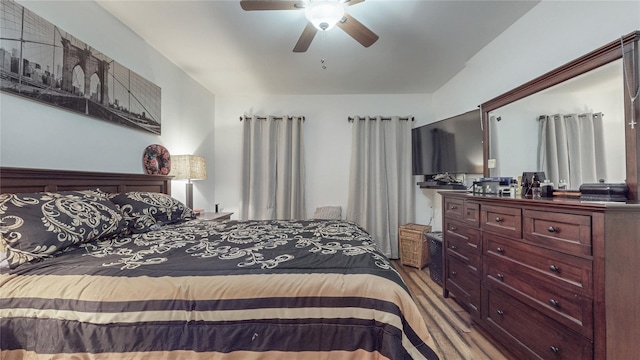 bedroom featuring ceiling fan and wood finished floors