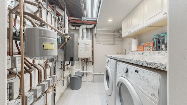 laundry area with cabinet space and washing machine and clothes dryer