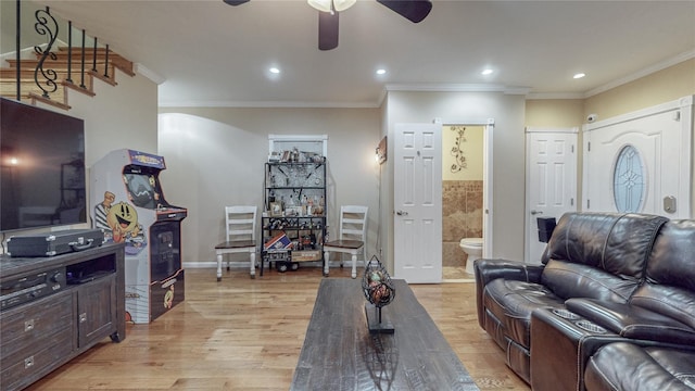 2850 Harrington Ave, Bronx, NY 10461 - living room featuring ornamental molding, a ceiling fan, arched walkways, and light wood finished floors