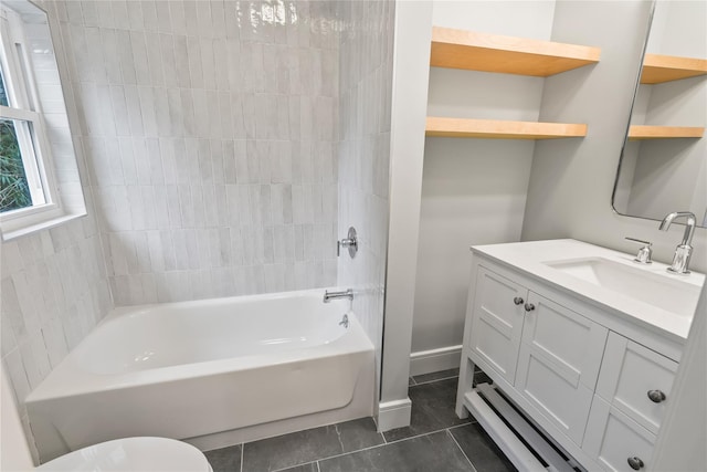 full bathroom with vanity, tile patterned floors, toilet, and tiled shower / bath