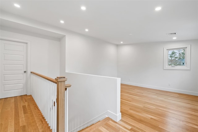 68 Glenlawn Ave, Sea Cliff, NY 11579 - hallway with an upstairs landing, light wood-type flooring, and recessed lighting