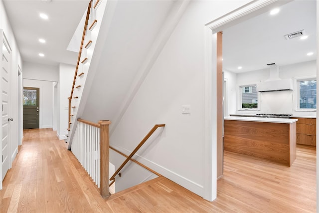 68 Glenlawn Ave, Sea Cliff, NY 11579 - corridor featuring light wood-style flooring, recessed lighting, and an upstairs landing