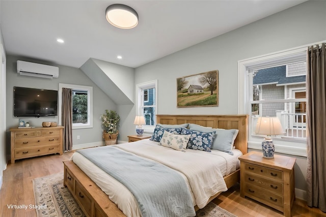 68 Glenlawn Ave, Sea Cliff, NY 11579 - bedroom with a wall mounted air conditioner, wood finished floors, and recessed lighting