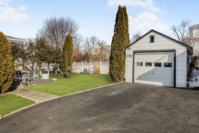 garage featuring a yard