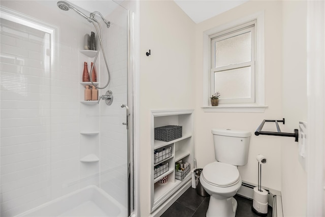 bathroom featuring a shower with door, a baseboard radiator, tile patterned floors, and toilet