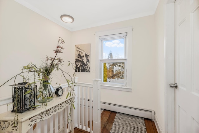 interior space with dark hardwood / wood-style floors and baseboard heating