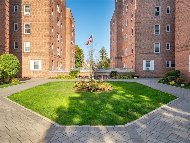 view of community featuring a lawn