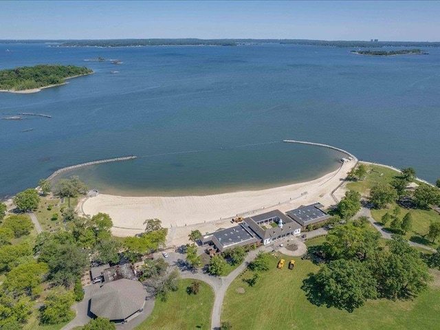 bird's eye view featuring a water view and a view of the beach