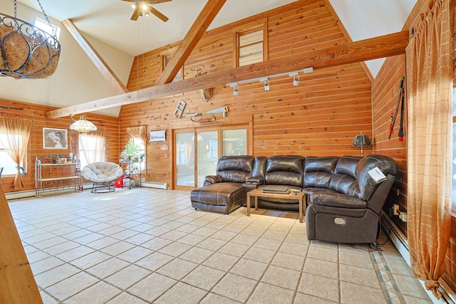 living area featuring wood walls, tile patterned flooring, and high vaulted ceiling