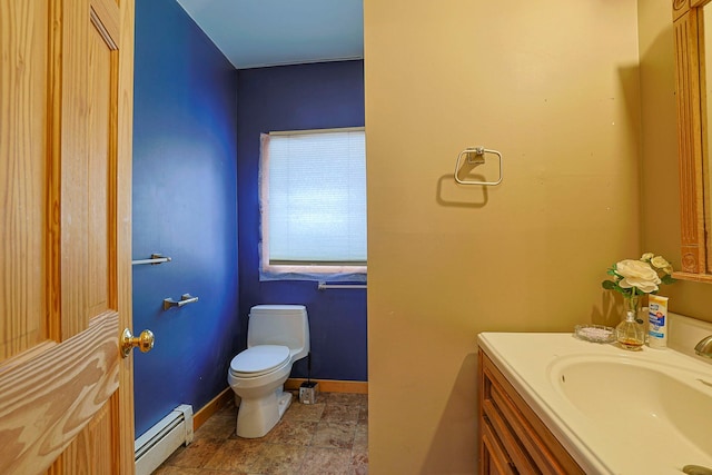 bathroom featuring toilet, a baseboard radiator, baseboards, and vanity