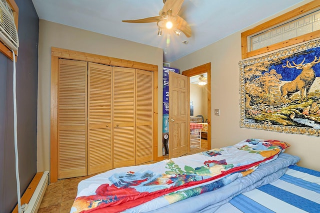 bedroom with ceiling fan, a closet, and a baseboard radiator
