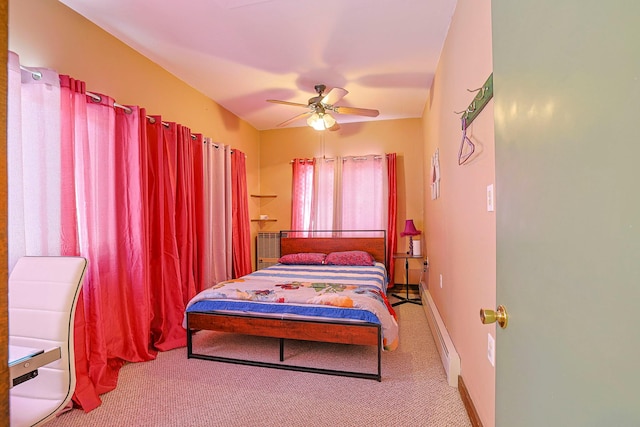 bedroom with carpet floors, ceiling fan, baseboards, and baseboard heating