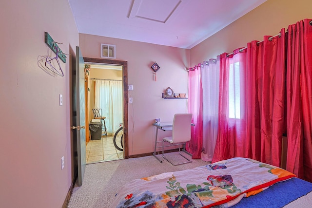bedroom with light colored carpet, visible vents, and baseboards