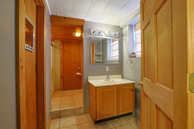 bathroom featuring tile patterned flooring and vanity
