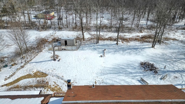 view of yard layered in snow