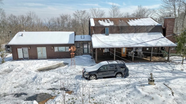 rustic home featuring an attached carport