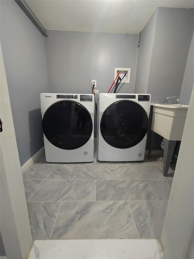 laundry area with independent washer and dryer