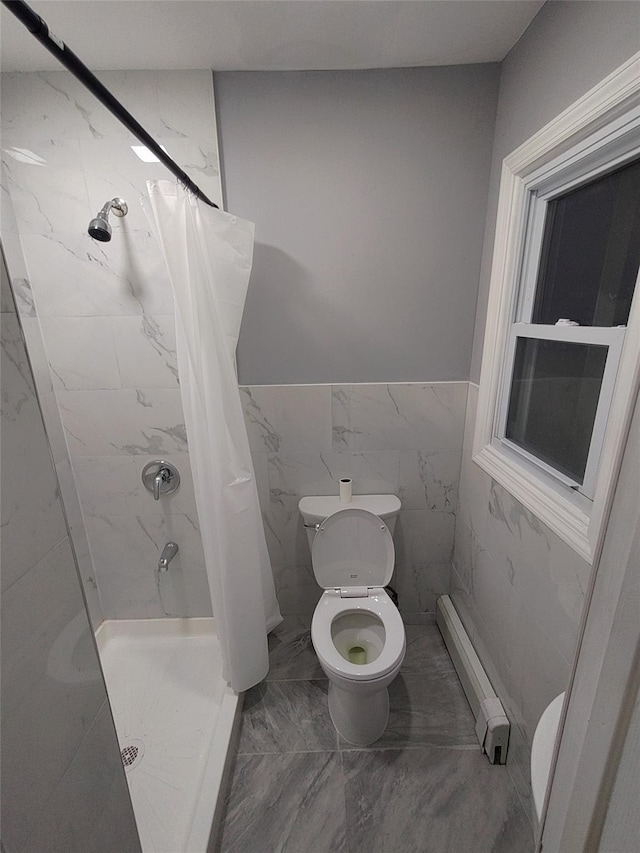 bathroom featuring curtained shower, toilet, and baseboard heating