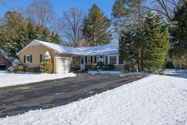 single story home with a garage