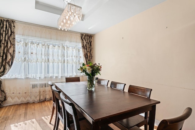 dining space with light wood-type flooring