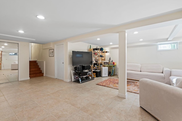 living room featuring stairs, baseboards, and recessed lighting