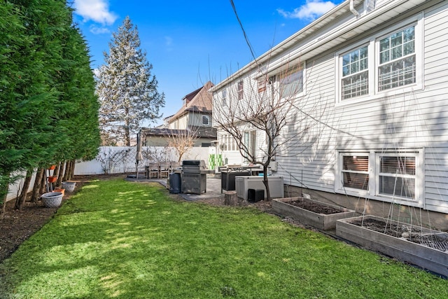 view of yard featuring a garden and fence