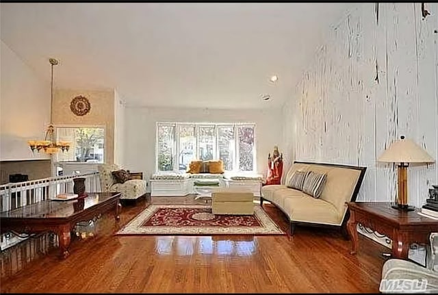 sitting room with wood-type flooring