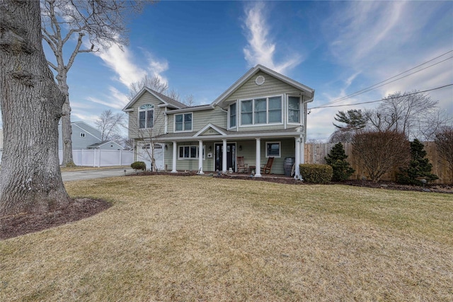 view of front of house with a porch and a front yard